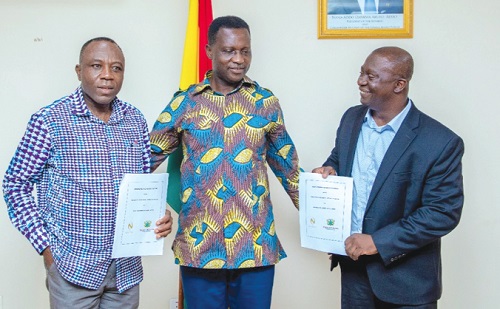 Dr Yaw Osei Adutwum (middle), Education Minister, with Edmund Poku (right), MD, Niche Cocoa Industry Limited, and Divine Ayizoe, acting Chief Director of the ministry after the signing of the memorandum of understanding in Accra Dr Yaw Osei Adutwum (middle), Education Minister, with Edmund Poku (right), MD, Niche Cocoa Industry Limited, and Divine Ayizoe, acting Chief Director of the ministry after the signing of the memorandum of understanding in Accra